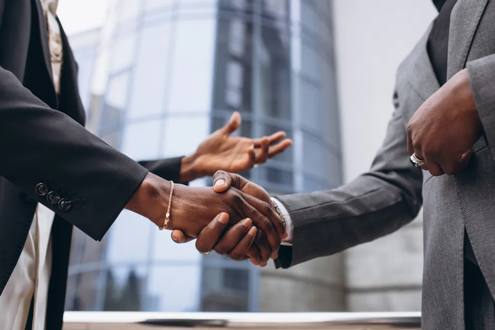 Business handshake representing public-private partnerships